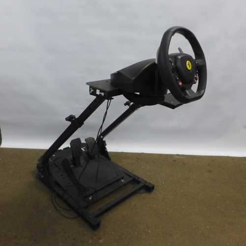 2160 - A video game racing simulator set up including a GT Omega racing style gaming chair, a racing simula... 