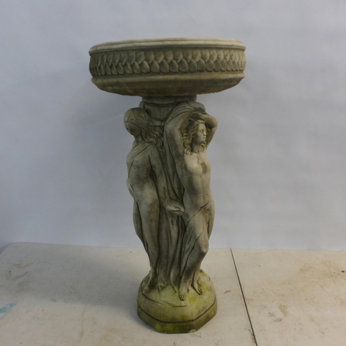 2180 - A 75cm tall two-section concrete Three Graces bird bath