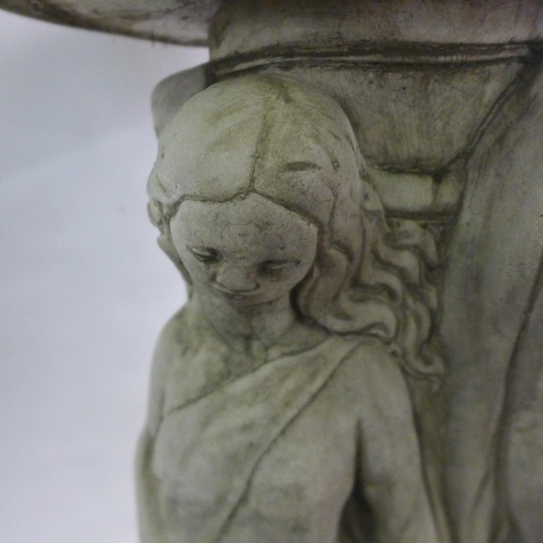 2180 - A 75cm tall two-section concrete Three Graces bird bath