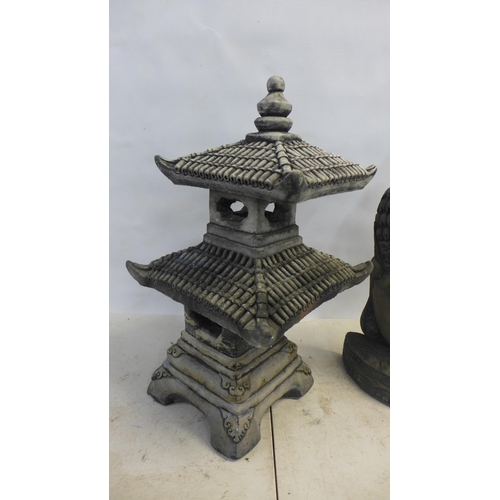 2183 - A 65cm, two tier antique effect concrete pagoda and a 60cm antique effect concrete Buddha bust ornam... 