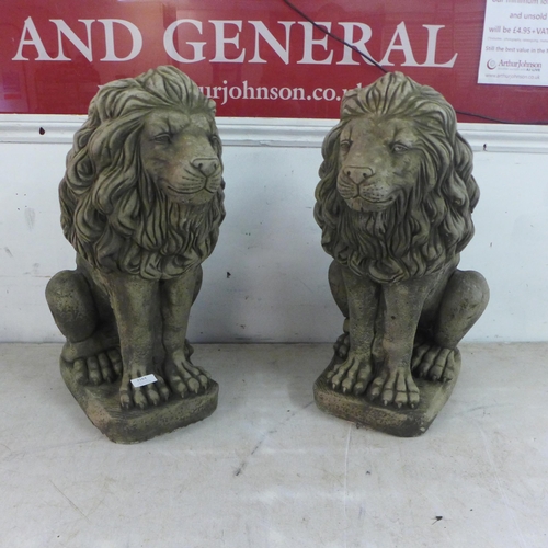 2184 - A pair of 60cm antique effect concrete lions