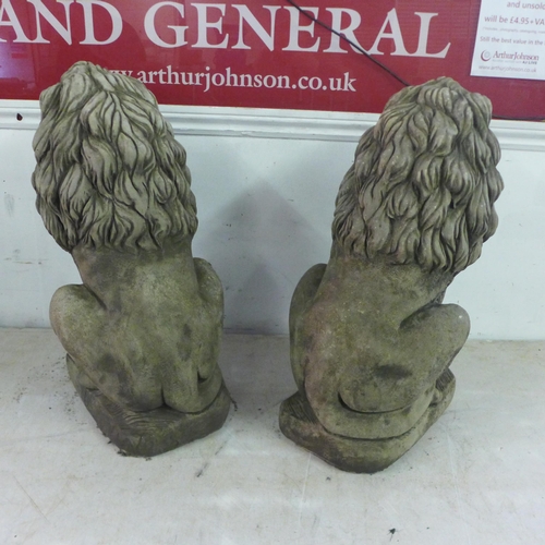 2184 - A pair of 60cm antique effect concrete lions