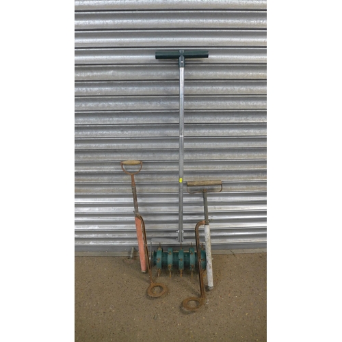 2215A - A bundle of garden tools including scythe, post hole digger, lawn aerator, etc.