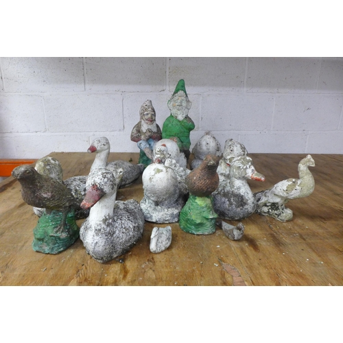 2221 - A collection of concrete garden items including gnomes and ducks etc and a plastic garden compost bi... 