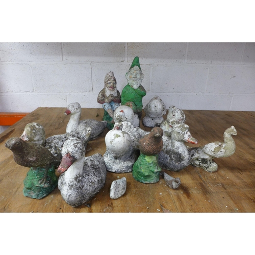 2221 - A collection of concrete garden items including gnomes and ducks etc and a plastic garden compost bi... 