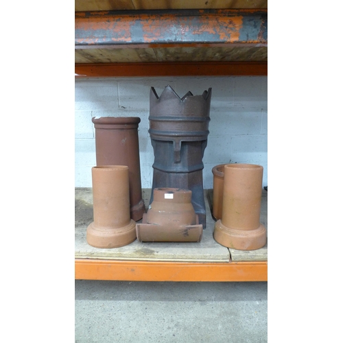 2224 - A collection of terracotta chimney pots in assorted sizes and styles