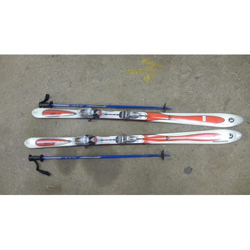 2232 - A pair of Rossignol skis and poles in carry case