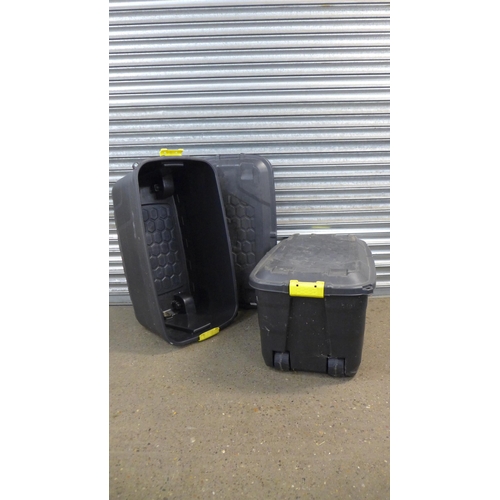 2253 - Two large black plastic mobile storage chests with lids