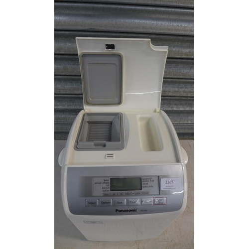 2265 - A Panasonic SD-255 automatic bread maker with operating instructions and recipe booklet