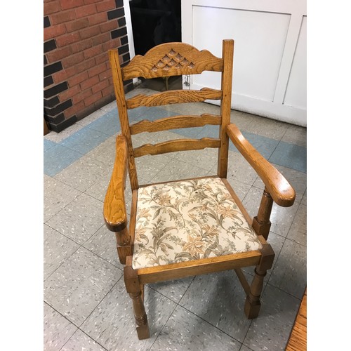 1540 - An oak dining table and six chairs