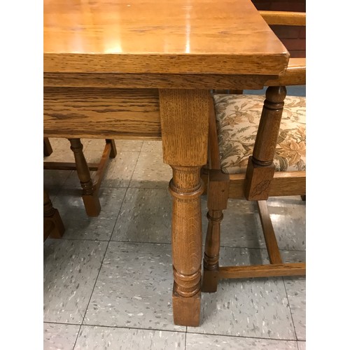 1540 - An oak dining table and six chairs