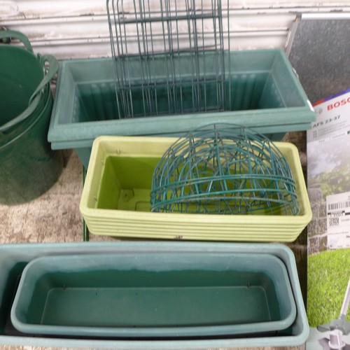 2204 - Ten assorted plastic troughs in assorted sizes including a trough planter with water tray insert, th... 