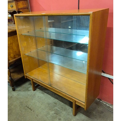 91 - A Turnidge of London teak display cabinet