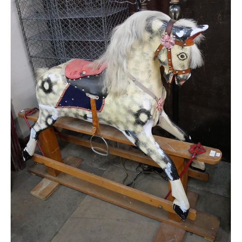 285 - A vintage dapple grey rocking horse