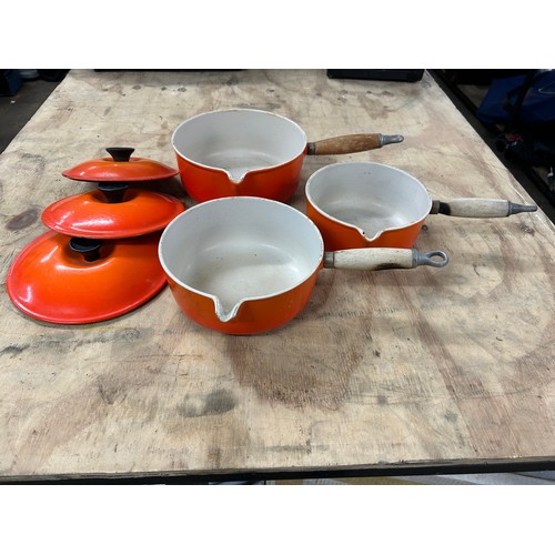 Three Le Creuset saucepans including an 18cm, 20cm and 22cm saucepan ...