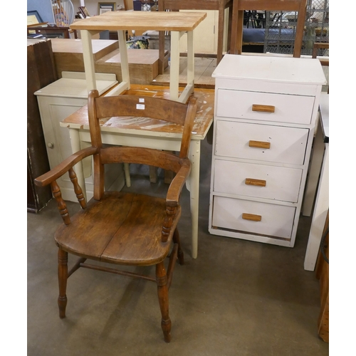 241 - Two pine tables, an armchair, a pot cupboard and a chest of drawers