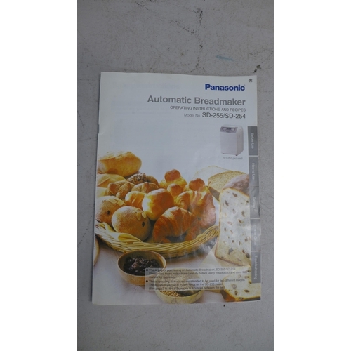 2265 - A Panasonic SD-255 automatic bread maker with operating instructions and recipe booklet