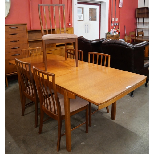 31 - A McIntosh teak extending T2 model dining table and six chairs