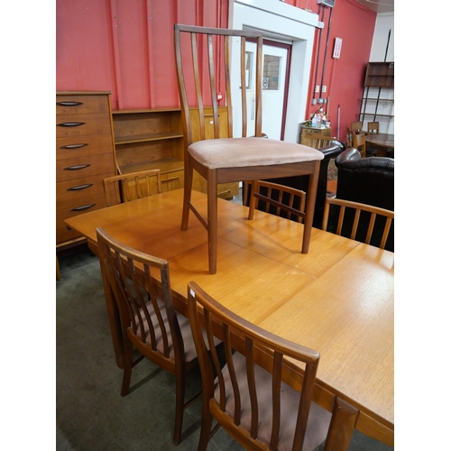 31 - A McIntosh teak extending T2 model dining table and six chairs