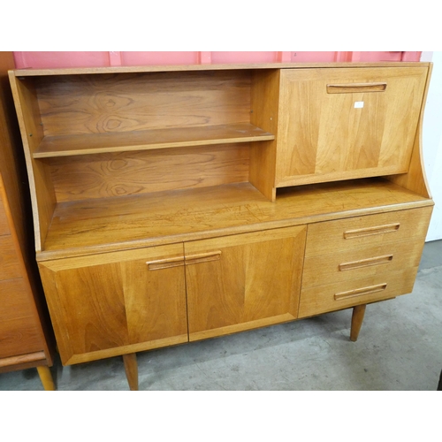 37 - A teak highboard