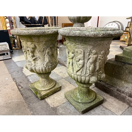 282A - A pair of Victorian style campana shaped concrete garden urns