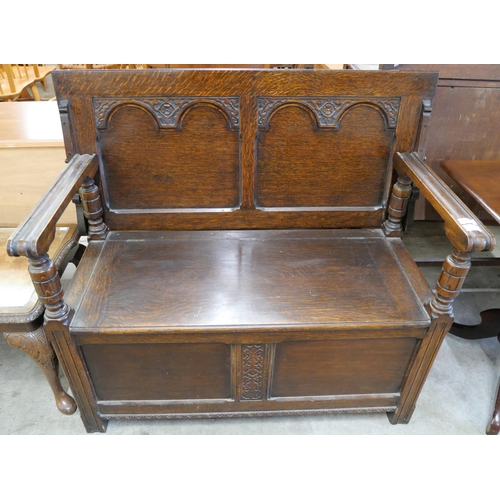 191 - A 17th Century style carved oak monk's bench