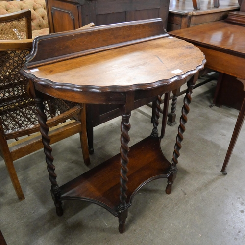 210 - An early 20th Century oak barleytwist demi-lune side table