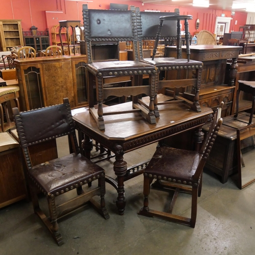 216 - A 19th Century French carved oak centre table and four chairs