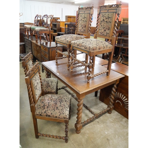 227 - An early 20th Century French oak barleytwist dining table and four chairs