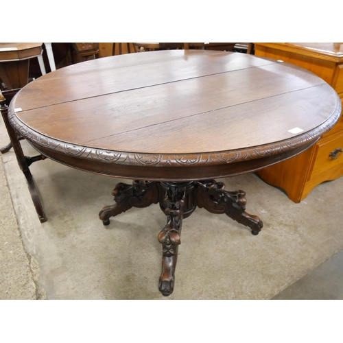 230 - A 19th Century French carved oak circular centre table