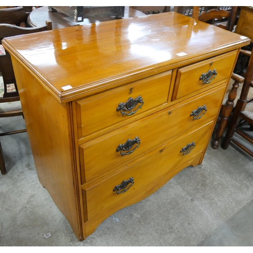 231 - A late Victorian satin birch chest of drawers