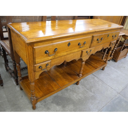 233 - A George II style oak dresser