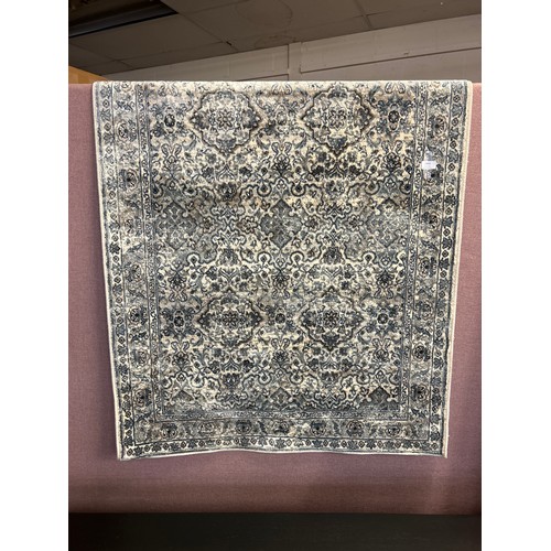 1509 - An ivory and duck egg blue Cashmere ground rug, all over floral pattern, 100 x 140cm