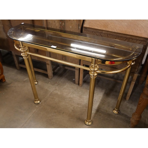 259 - An Italian style brass and glass topped console table