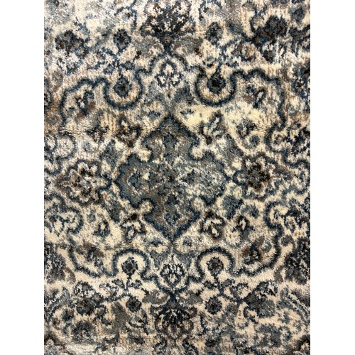 1509 - An ivory and duck egg blue Cashmere ground rug, all over floral pattern, 100 x 140cm