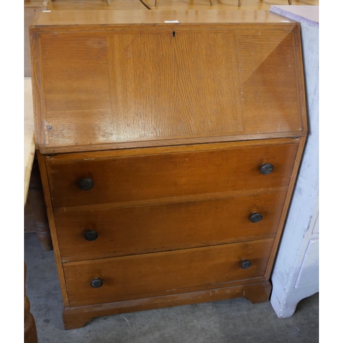 265 - An oak bureau, folding chair, a teak sewing box and two others