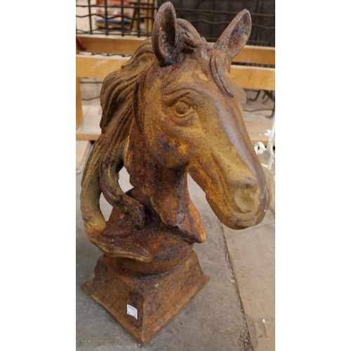 286 - A pair of cast iron horse's head garden ornaments