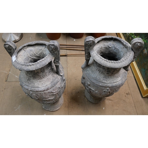 306 - A pair of Victorian Romanesque lead garden urns