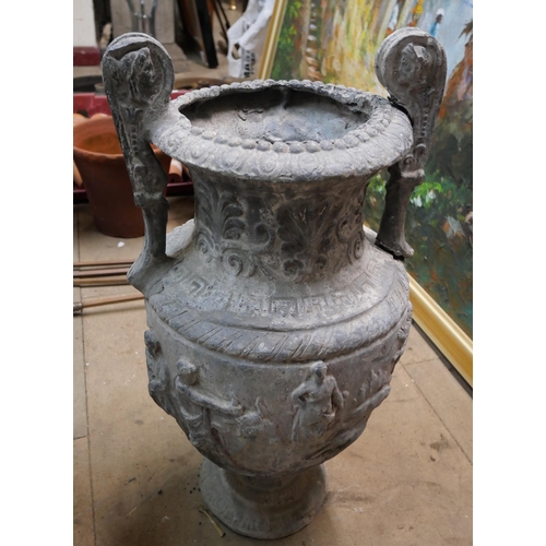 306 - A pair of Victorian Romanesque lead garden urns