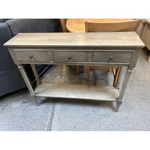 1557 - A three drawer console table