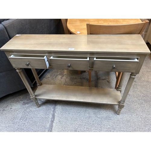 1557 - A three drawer console table