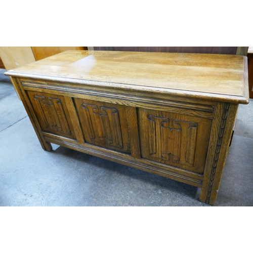 131A - A carved oak linenfold blanket box