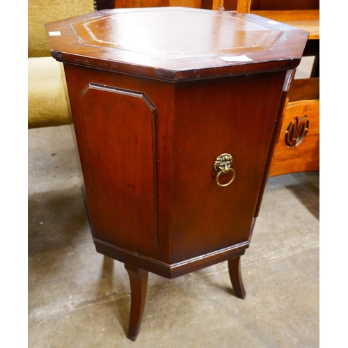 132 - A Regency style mahogany and leather topped octagonal cocktail cabinet