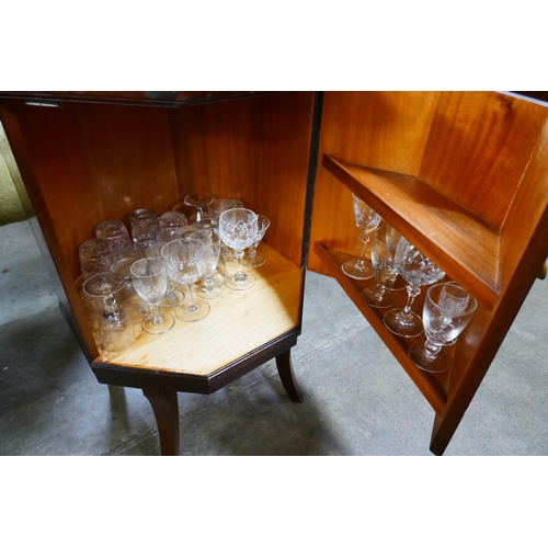 132 - A Regency style mahogany and leather topped octagonal cocktail cabinet