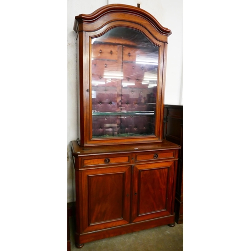 144 - A 19th Century French Empire style mahogany bookcase