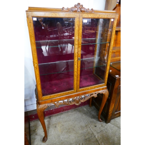 149 - A Queen Anne style burr walnut display cabinet