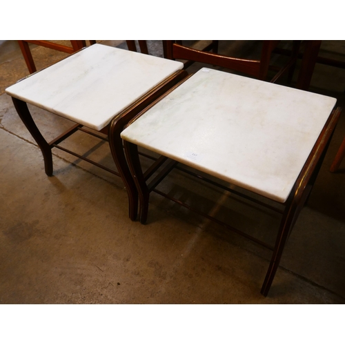 157 - A pair of mahogany and marble topped coffee tables