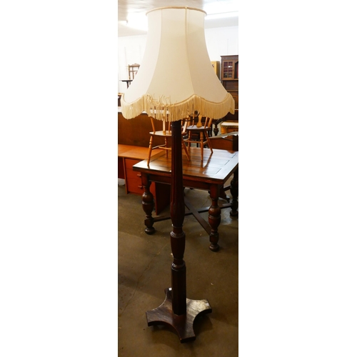 161 - A Hepplewhite Revival carved mahogany standard lamp