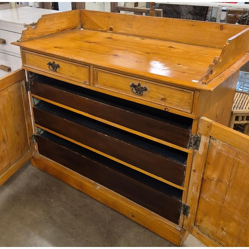 241A - A Victorian pine two door press cupboard