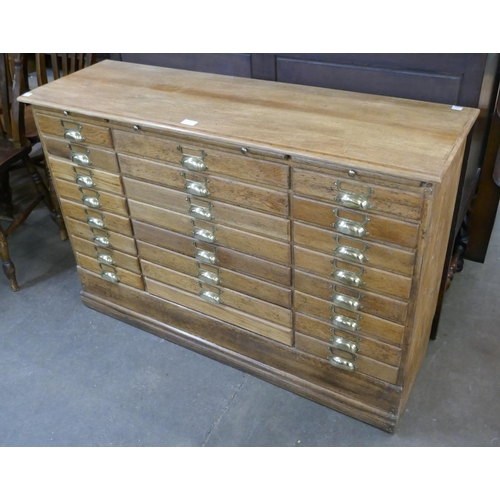 107 - An oak index drawer filing cabinet